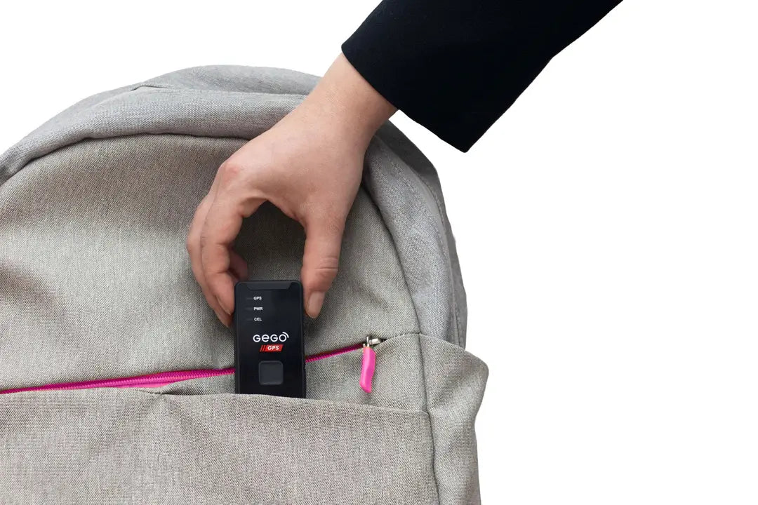 Person placing a gego device into a gray backpack with a white background