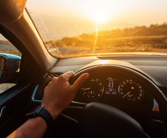 Person driving with GEGO PRO GPS car tracker for vehicles